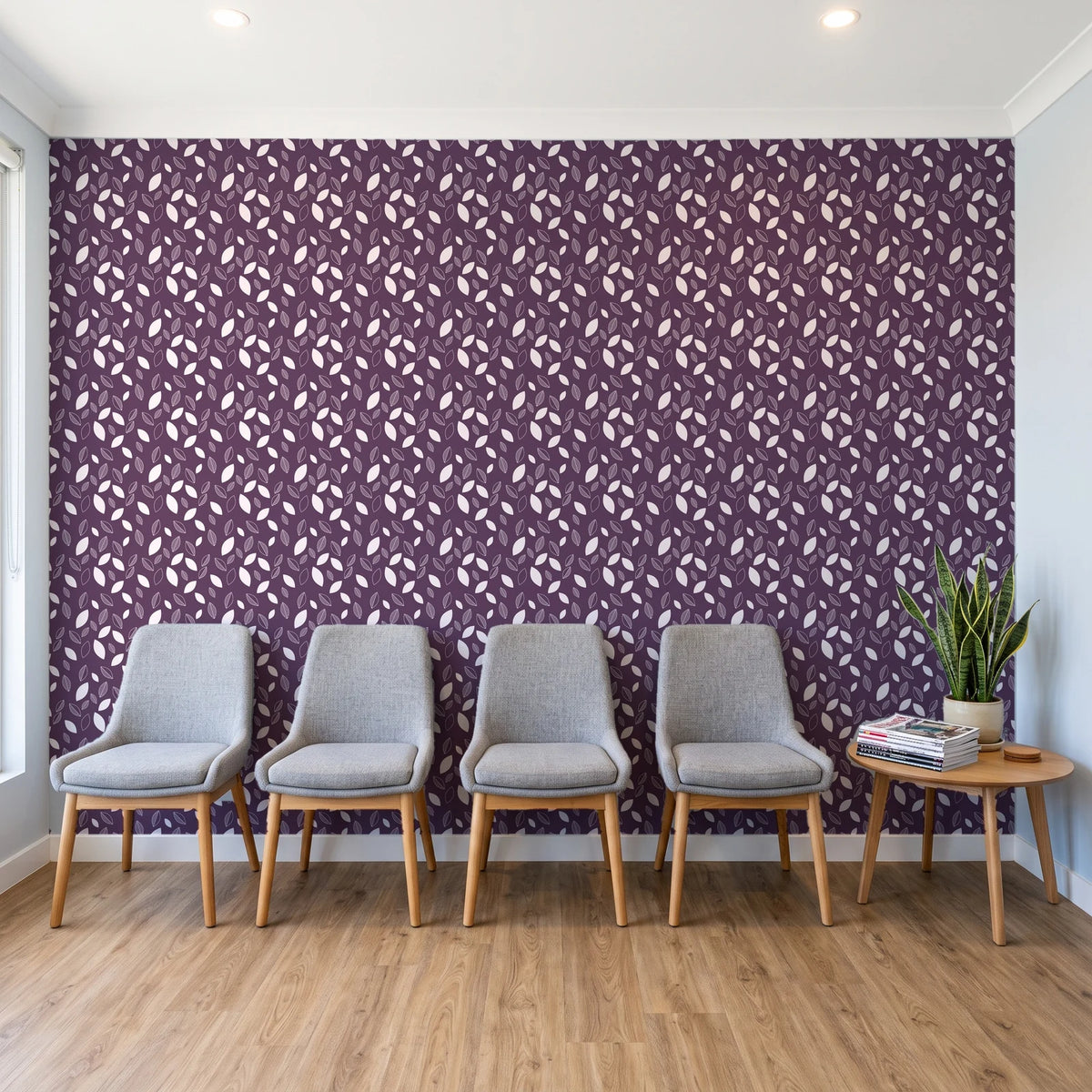 Linen & Leaf Plum leaf wallpaper behind a row of upholstered chairs in a bright clinic waiting room