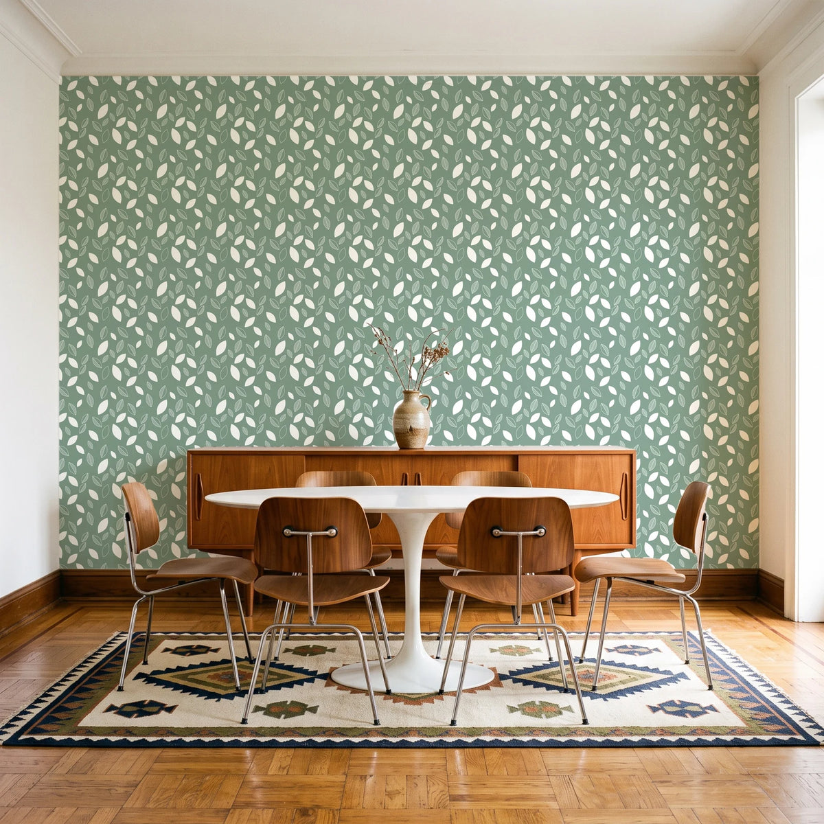 Linen & Leaf Sage leaf wallpaper in a mid-century dining room with a teak sideboard and tulip table