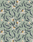 Magnolia Morning Charcoal magnolia bloom wallpaper in charcoal and brass