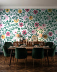 Matisse Reverie Emerald folk floral wallpaper in a dark moody dining room with a candlelit table