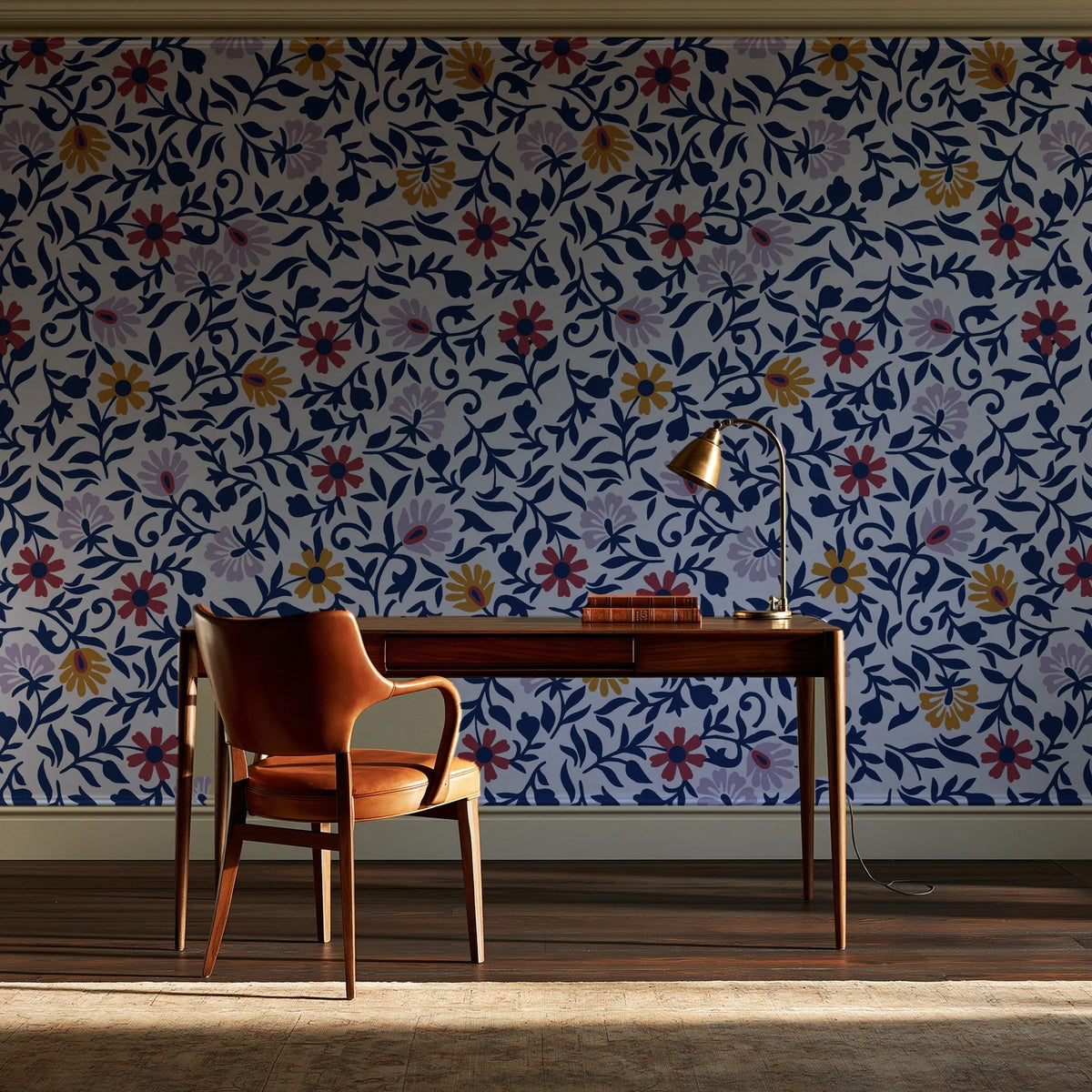 Matisse Reverie Navy folk floral wallpaper as a feature wall in a home study