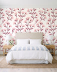Meadow Light Blush meadow flower wallpaper behind a queen bed in a bright coastal bedroom