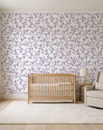 Meadow Wander Plum floral vine wallpaper in a calm, light-filled nursery
