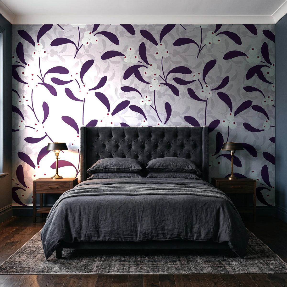 Mistletoe Trail Aubergine mistletoe wallpaper behind a tufted headboard in a dark, moody bedroom