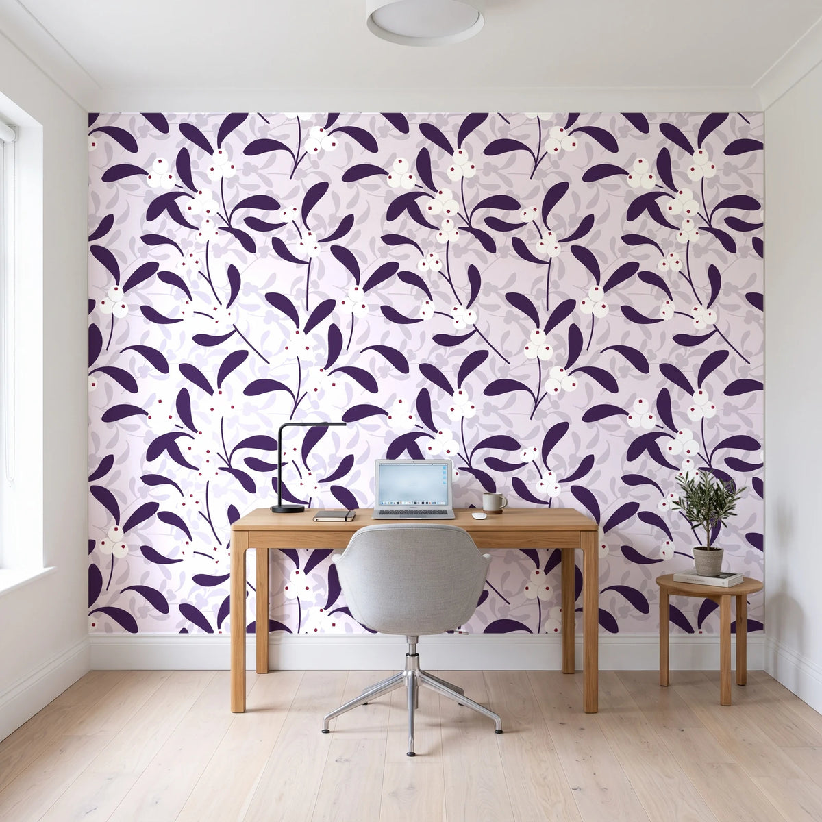 Mistletoe Trail Aubergine mistletoe wallpaper behind a modern oak desk in a bright home office