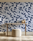 Mistletoe Trail Navy mistletoe wallpaper on the wall of a grand entry foyer