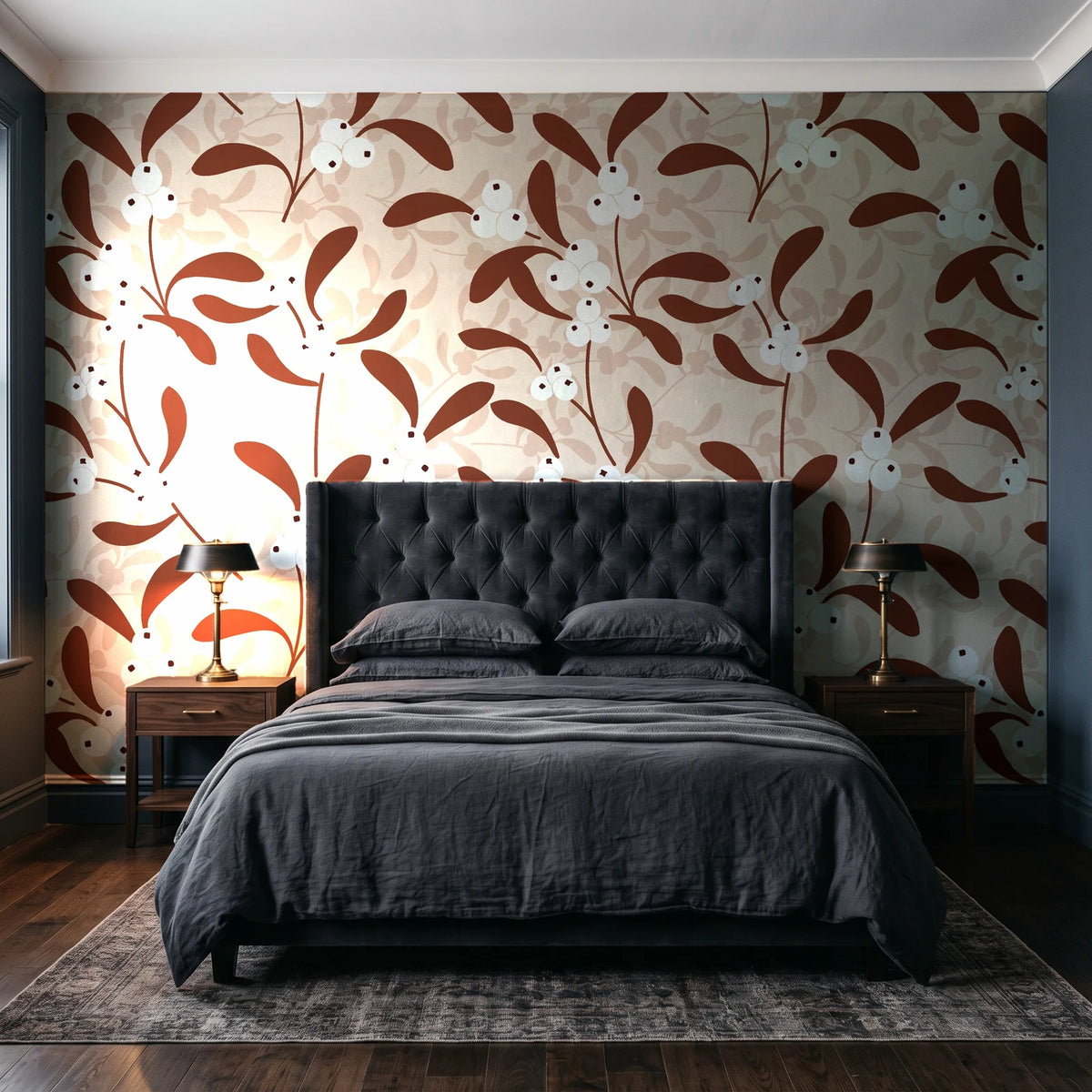 Mistletoe Trail Terracotta mistletoe wallpaper behind a tufted headboard in a dark, moody bedroom