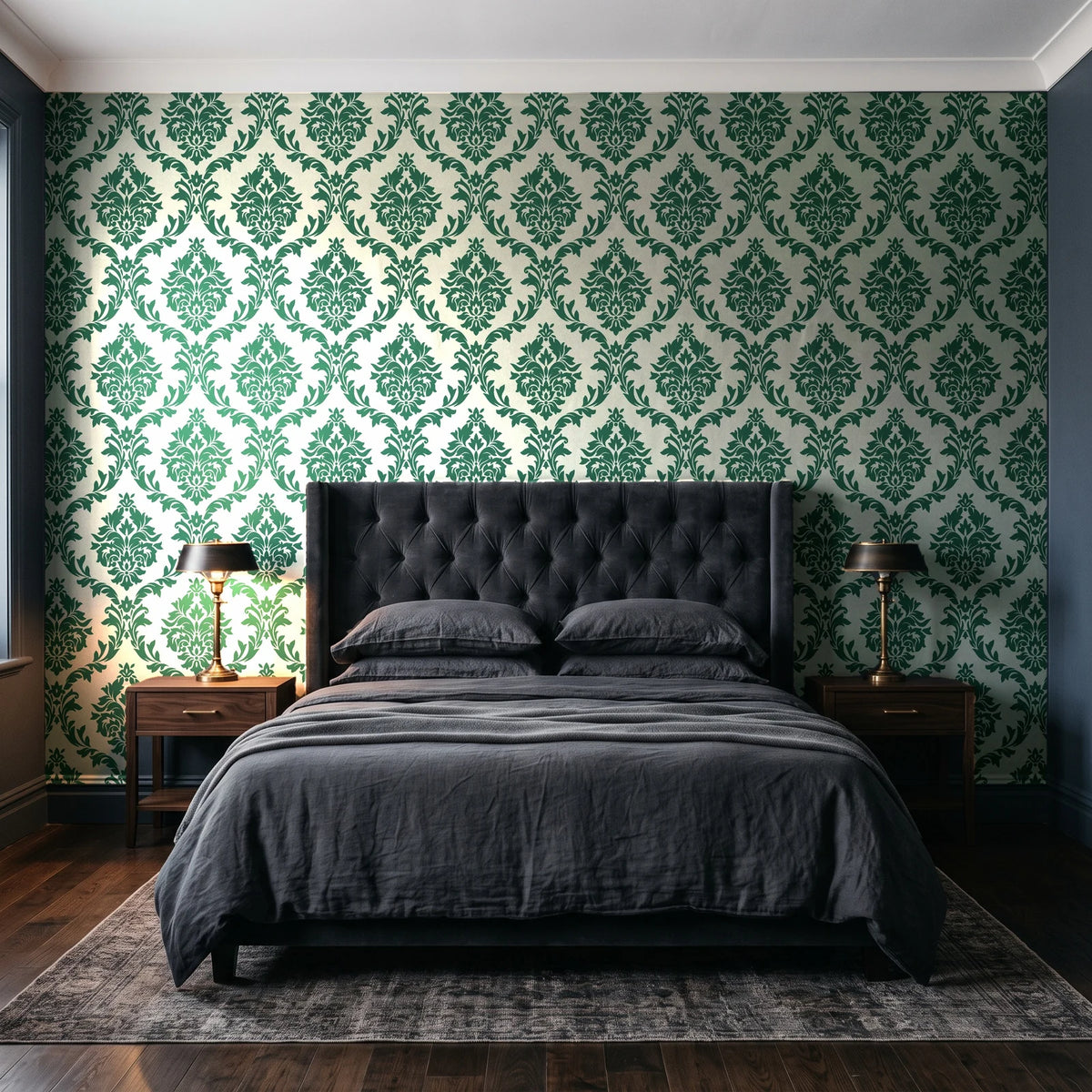 Misty Fern Romance Emerald damask wallpaper behind a tufted headboard in a dark, moody bedroom