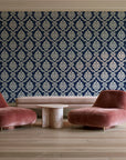Misty Fern Romance Midnight damask wallpaper in a boutique hotel sitting area