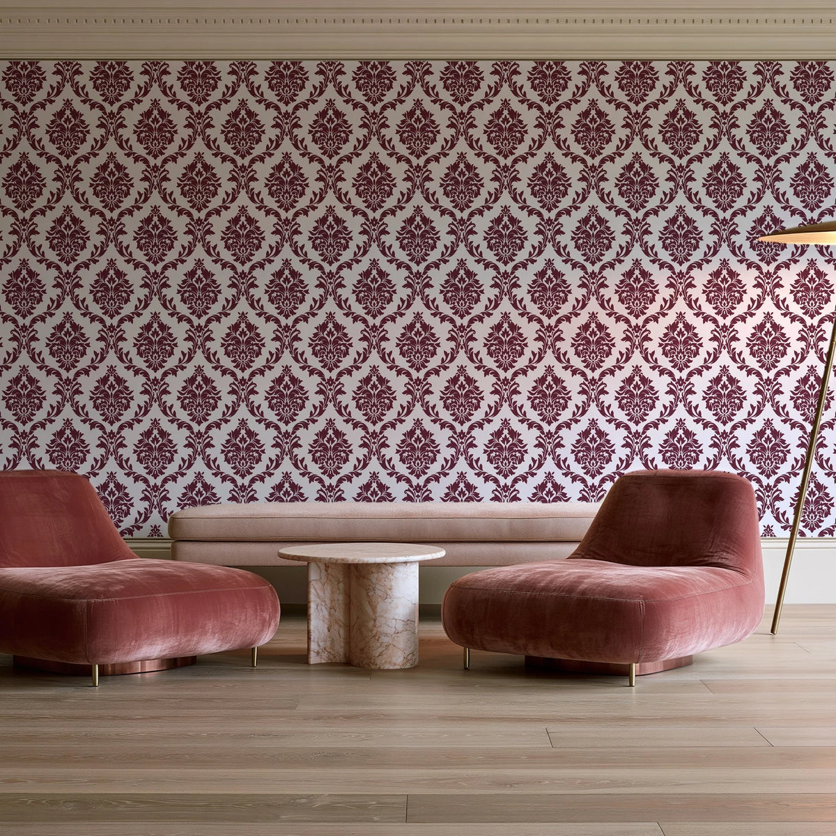 Misty Fern Romance Oxblood damask wallpaper in a boutique hotel sitting area
