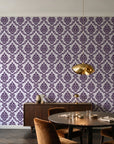 Misty Fern Romance Plum damask wallpaper in an elegant dining room