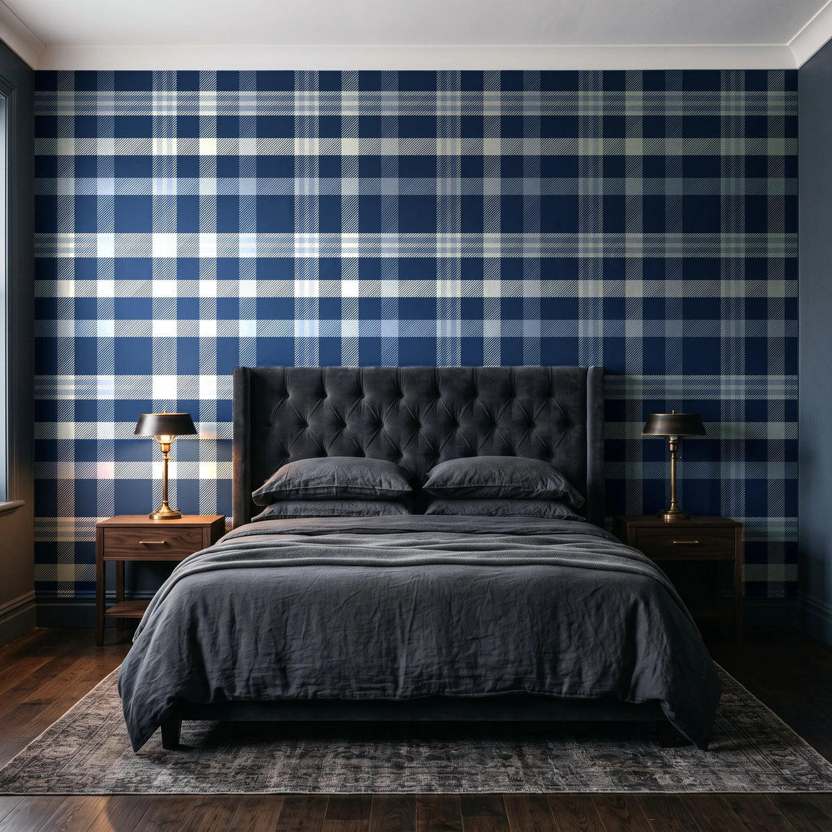 Moors & Mist Navy plaid wallpaper behind a tufted headboard in a dark, moody bedroom