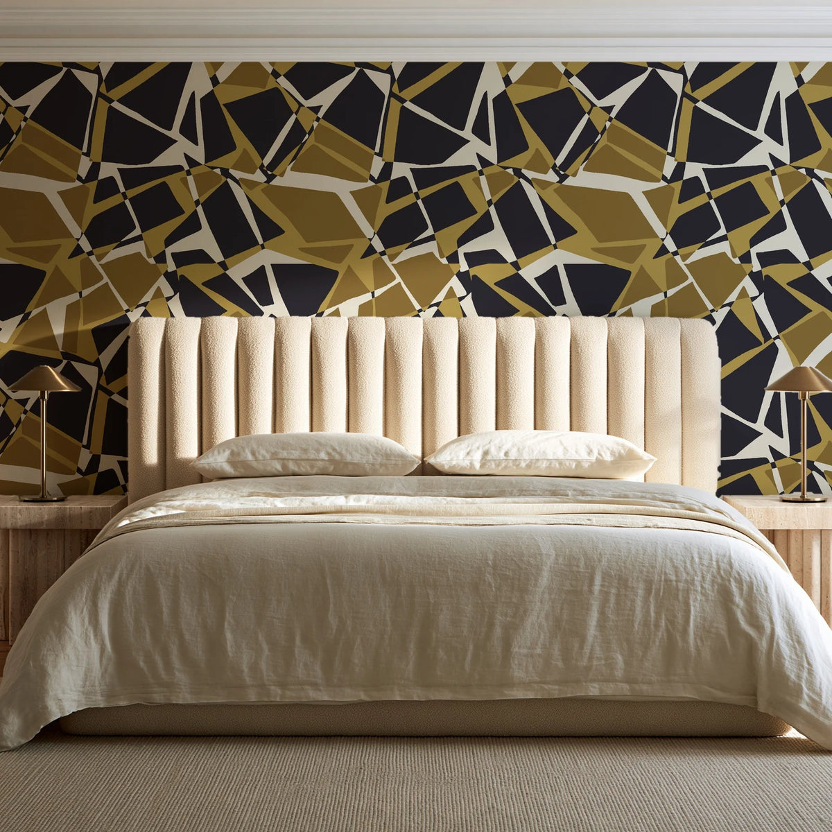 Muted Block Graphite geometric wallpaper behind a channel-tufted bed in a calm primary bedroom