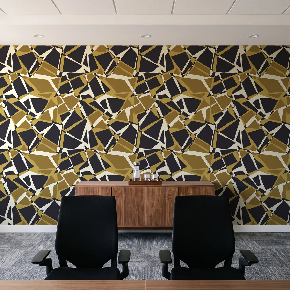 Muted Block Graphite geometric wallpaper above a walnut credenza in a modern conference room