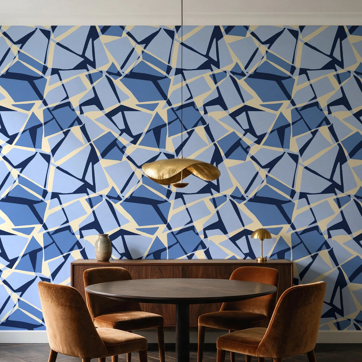 Muted Block Indigo geometric wallpaper behind a walnut credenza and round table in an elegant dining room