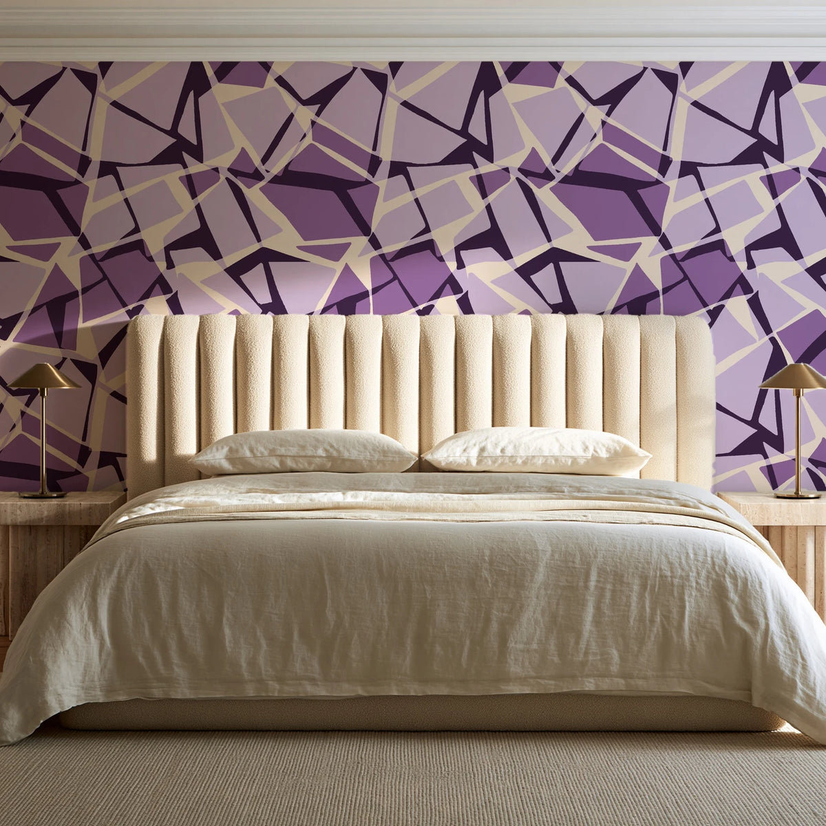 Muted Block Plum geometric wallpaper behind a channel-tufted bed in a calm primary bedroom