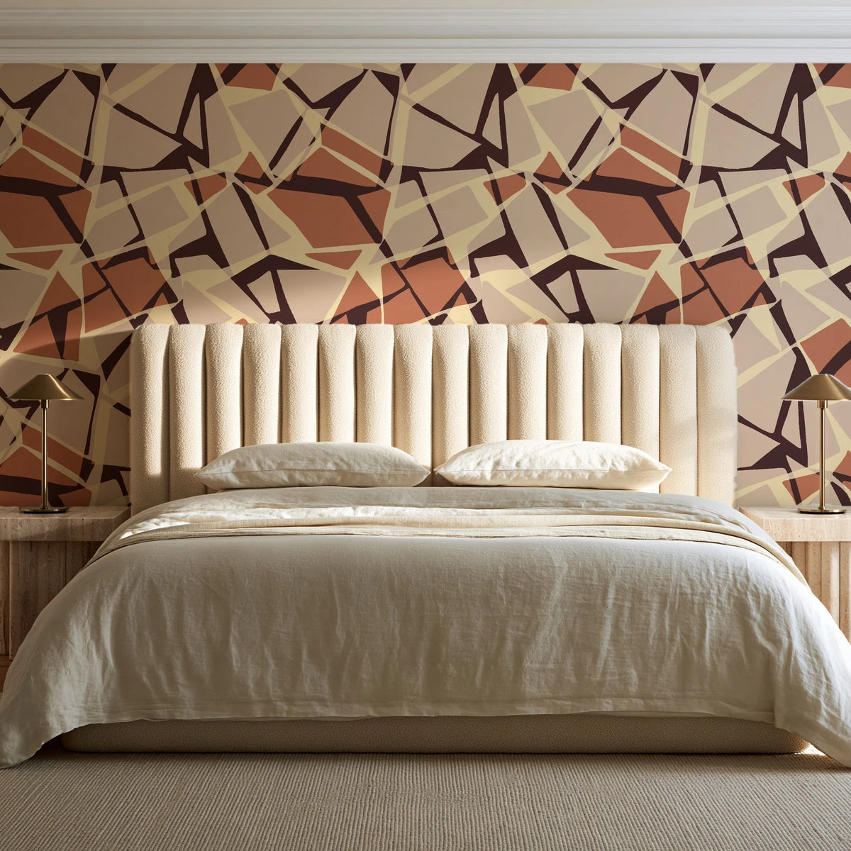 Muted Block Terracotta geometric wallpaper behind a channel-tufted bed in a calm primary bedroom