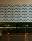 Ocean Fortress Ivory art deco scale wallpaper in an intimate luxury cocktail lounge