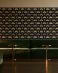 Ocean Fortress Onyx art deco scale wallpaper in an intimate luxury cocktail lounge