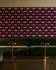 Ocean Fortress Oxblood art deco scale wallpaper in an intimate luxury cocktail lounge