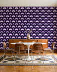 Ocean Fortress Plum art deco scale wallpaper in a mid-century dining room with a teak sideboard and tulip table