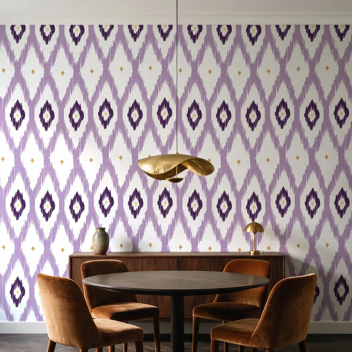Ogee Loom Plum ikat ogee wallpaper behind a walnut credenza and round table in an elegant dining room