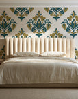 Old World Flora Ivory floral damask wallpaper behind a channel-tufted bed in a calm primary bedroom