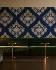Old World Flora Navy floral damask wallpaper in an intimate luxury cocktail lounge
