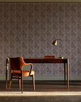 Olive Fret Terracotta geometric fret wallpaper as a feature wall in a home study