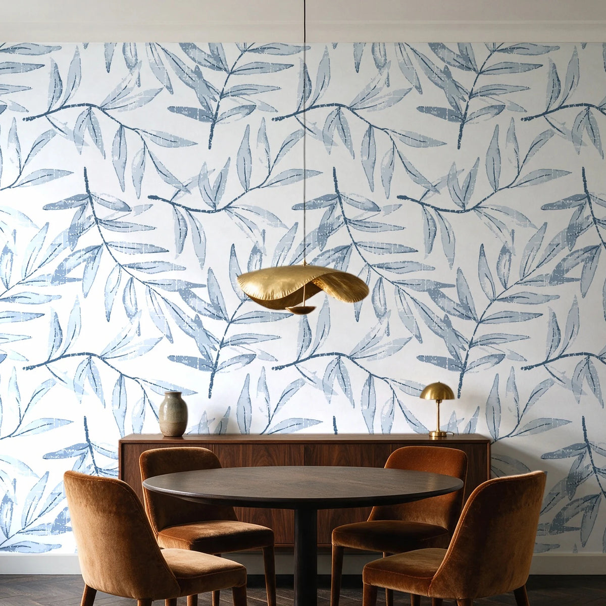 Pale Foliage Delft willow leaf wallpaper behind a walnut credenza and round table in an elegant dining room