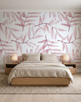 Pale Foliage Rose willow leaf wallpaper behind a low platform bed in a serene Japandi bedroom