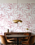 Pale Foliage Rose willow leaf wallpaper behind a walnut credenza and round table in an elegant dining room