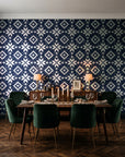 Pale Kilim Midnight kilim wallpaper in a dark moody dining room with a candlelit table