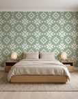 Pale Kilim Sage kilim wallpaper behind a low platform bed in a serene Japandi bedroom