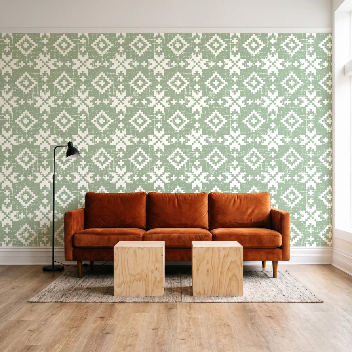 Pale Kilim Sage kilim wallpaper behind a rust velvet sofa in a bright coworking lounge