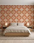 Pale Kilim Terracotta kilim wallpaper behind a low platform bed in a serene Japandi bedroom