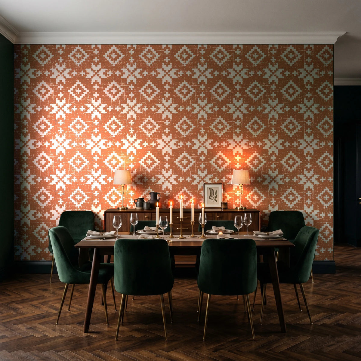 Pale Kilim Terracotta kilim wallpaper in a dark moody dining room with a candlelit table