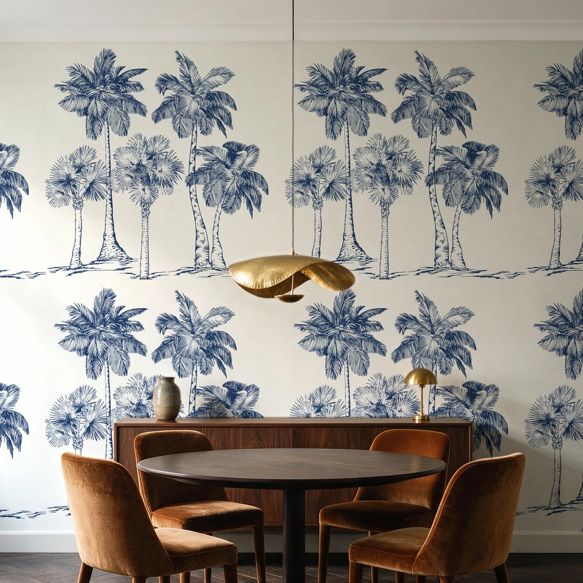 Palm Shade Navy palm grove wallpaper behind a walnut credenza and round table in an elegant dining room