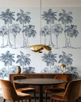 Palm Shade Slate palm grove wallpaper behind a walnut credenza and round table in an elegant dining room