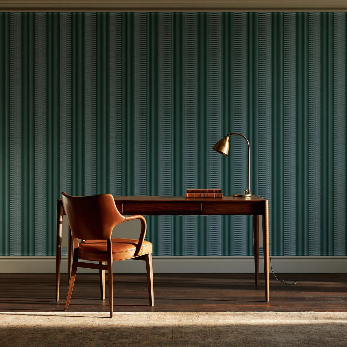 Parlor Stripe Emerald geometric stripe wallpaper as a feature wall in a home study