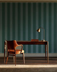 Parlor Stripe Emerald geometric stripe wallpaper as a feature wall in a home study