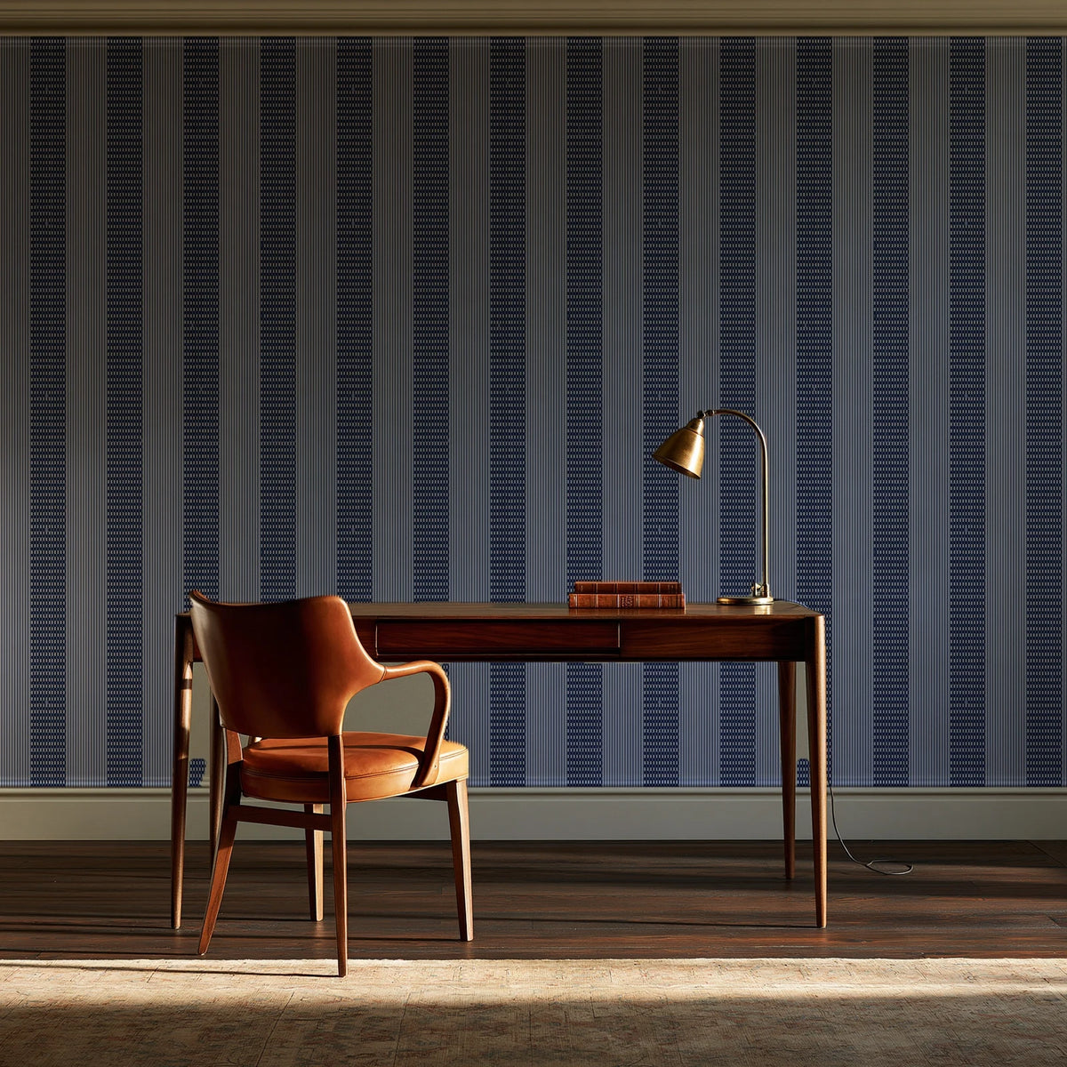 Parlor Stripe Midnight geometric stripe wallpaper as a feature wall in a home study