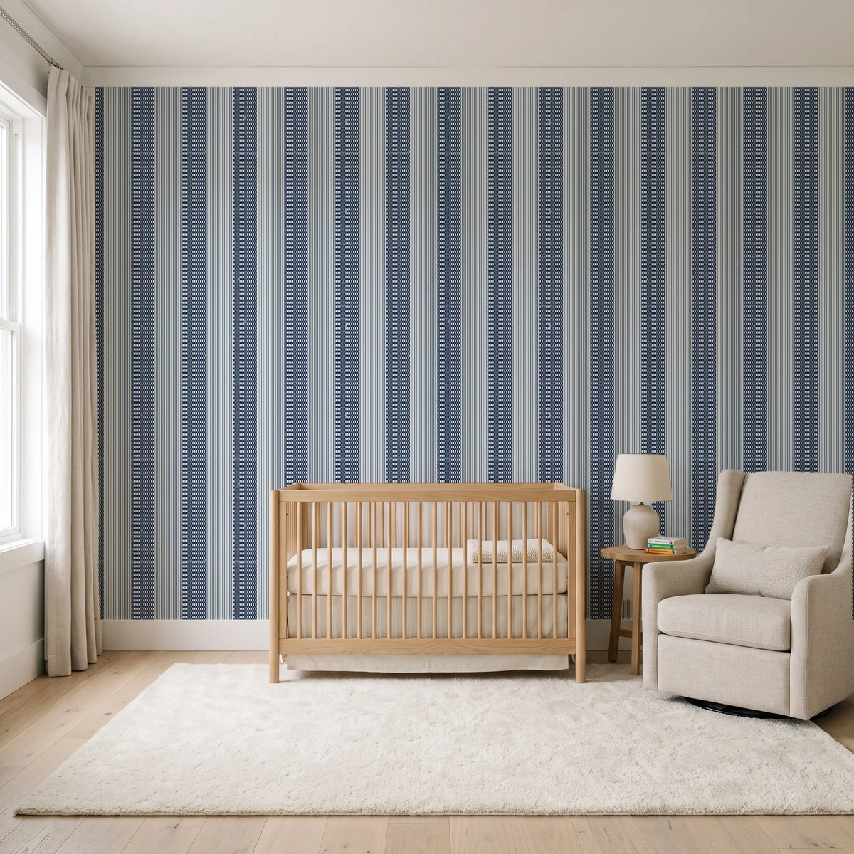 Parlor Stripe Midnight geometric stripe wallpaper in a calm, light-filled nursery