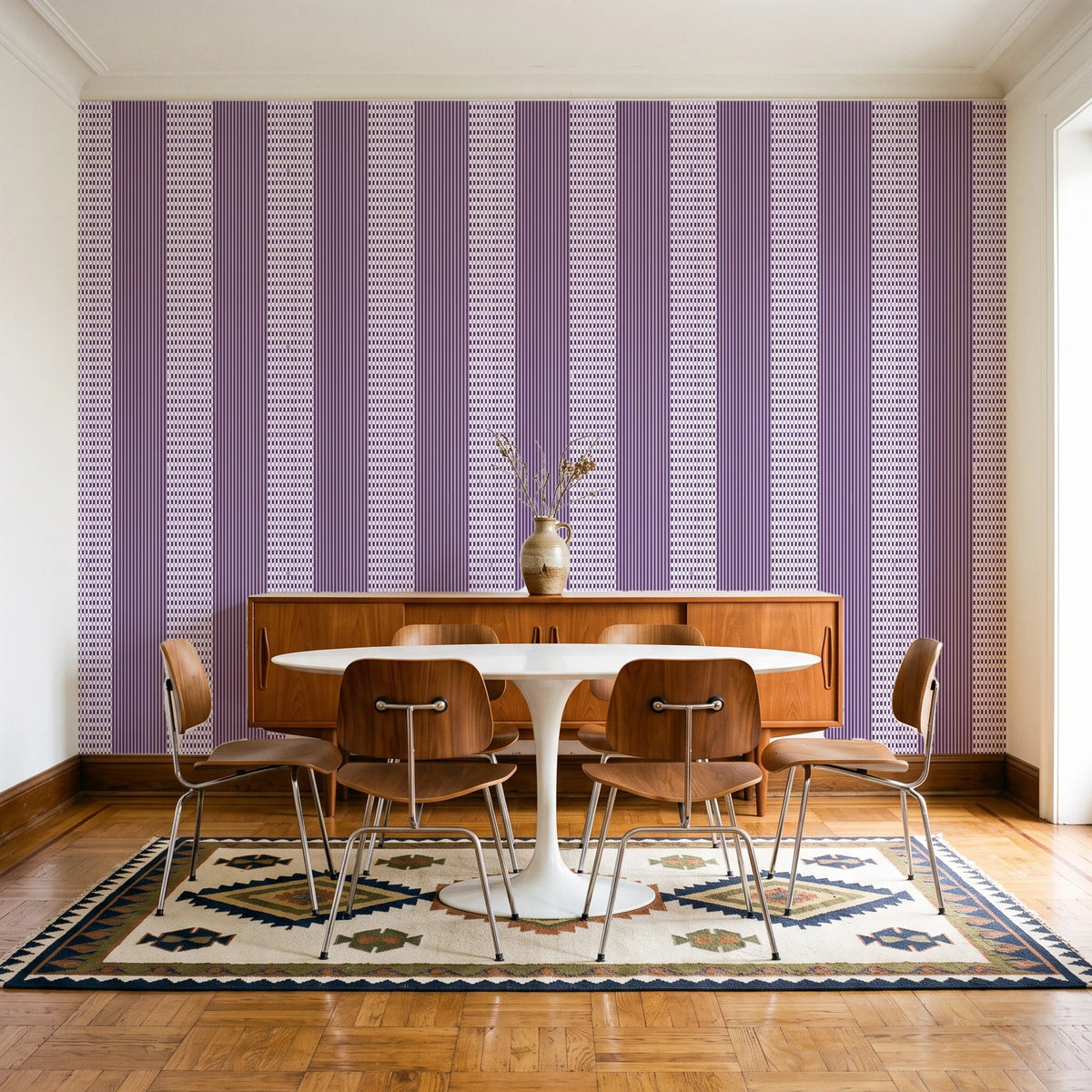 Parlor Stripe Plum geometric stripe wallpaper in a mid-century dining room with a teak sideboard and tulip table