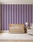Parlor Stripe Plum geometric stripe wallpaper in a calm, light-filled nursery