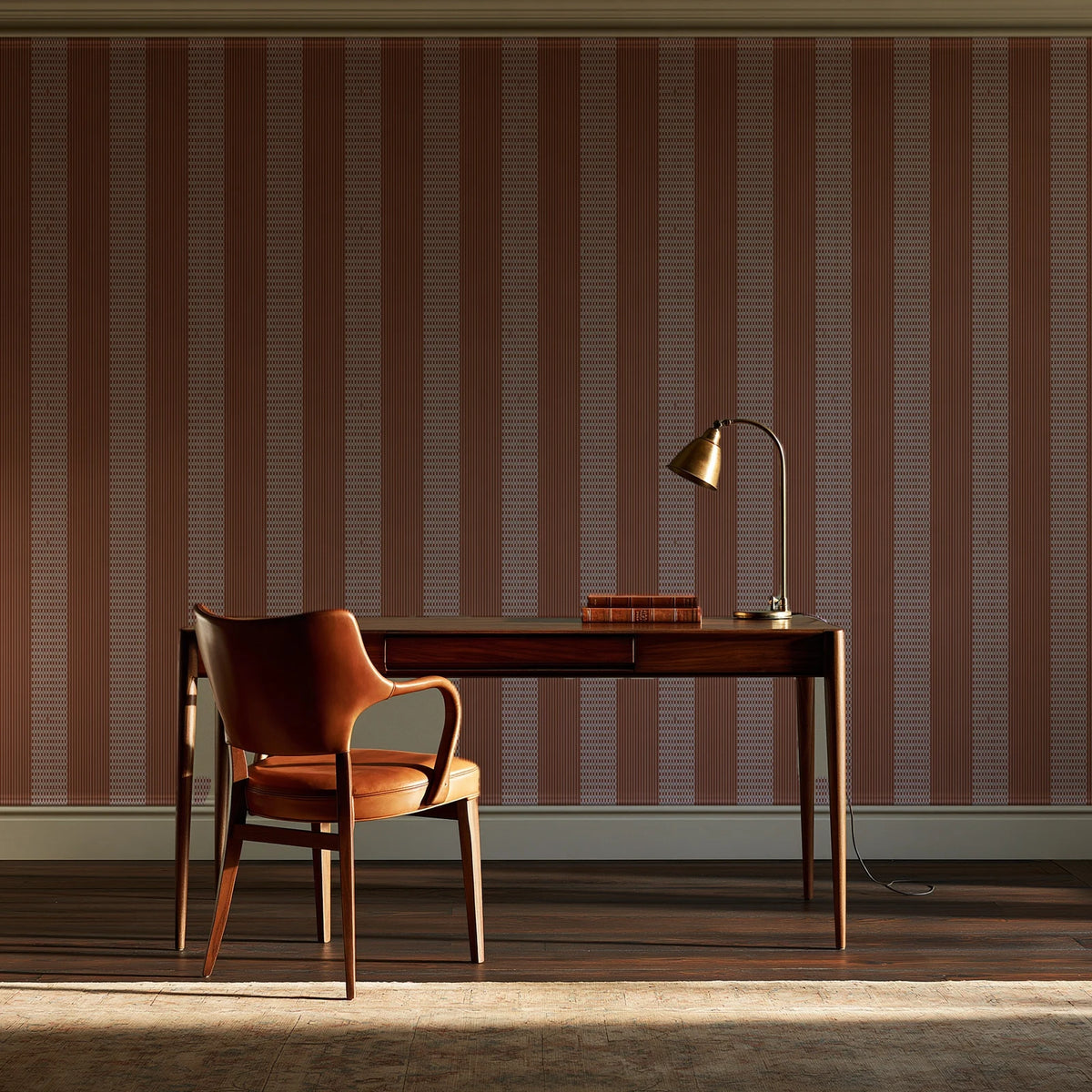 Parlor Stripe Terracotta geometric stripe wallpaper as a feature wall in a home study