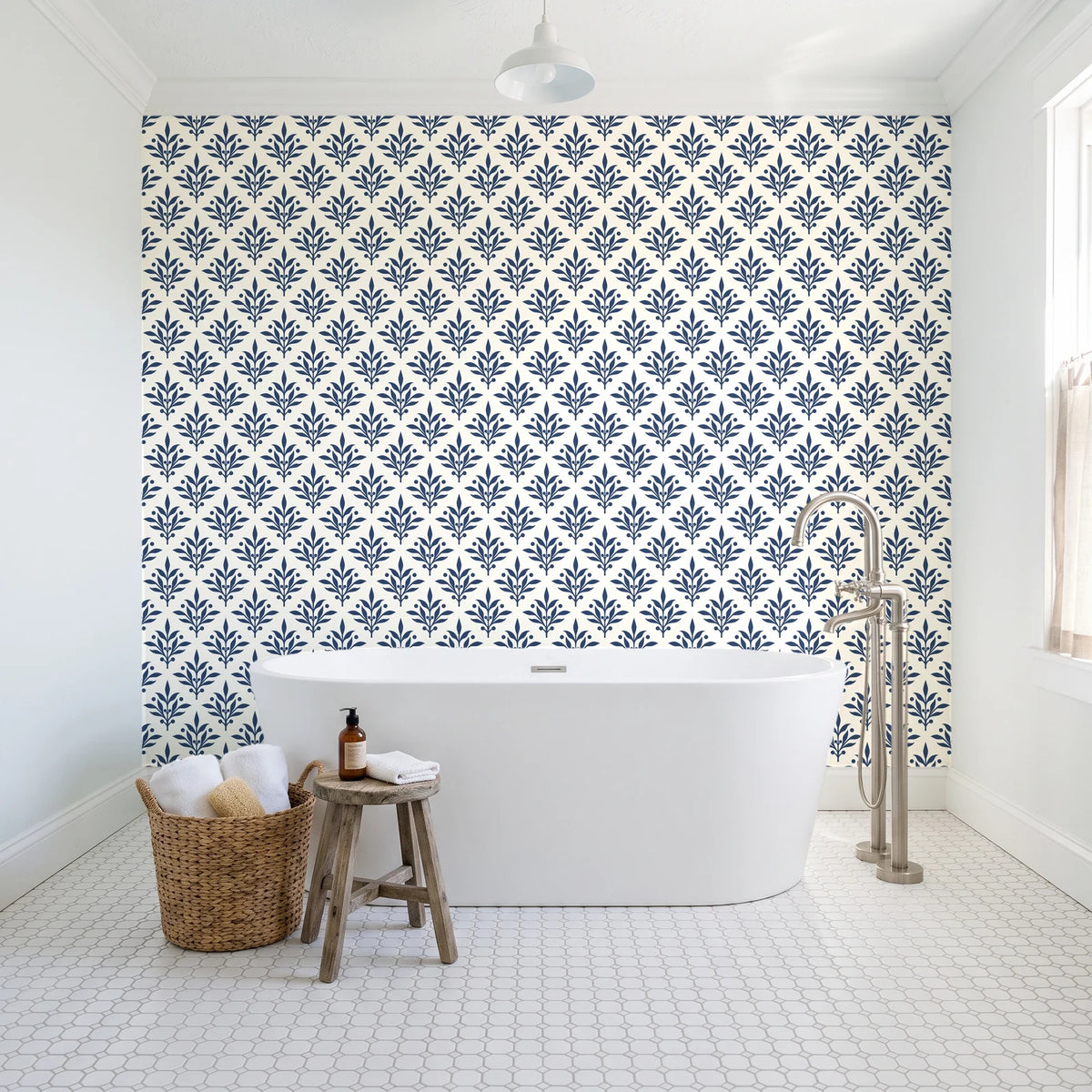 Pastel Bouquet Parade Navy botanical damask wallpaper behind a freestanding tub in a bright coastal bathroom