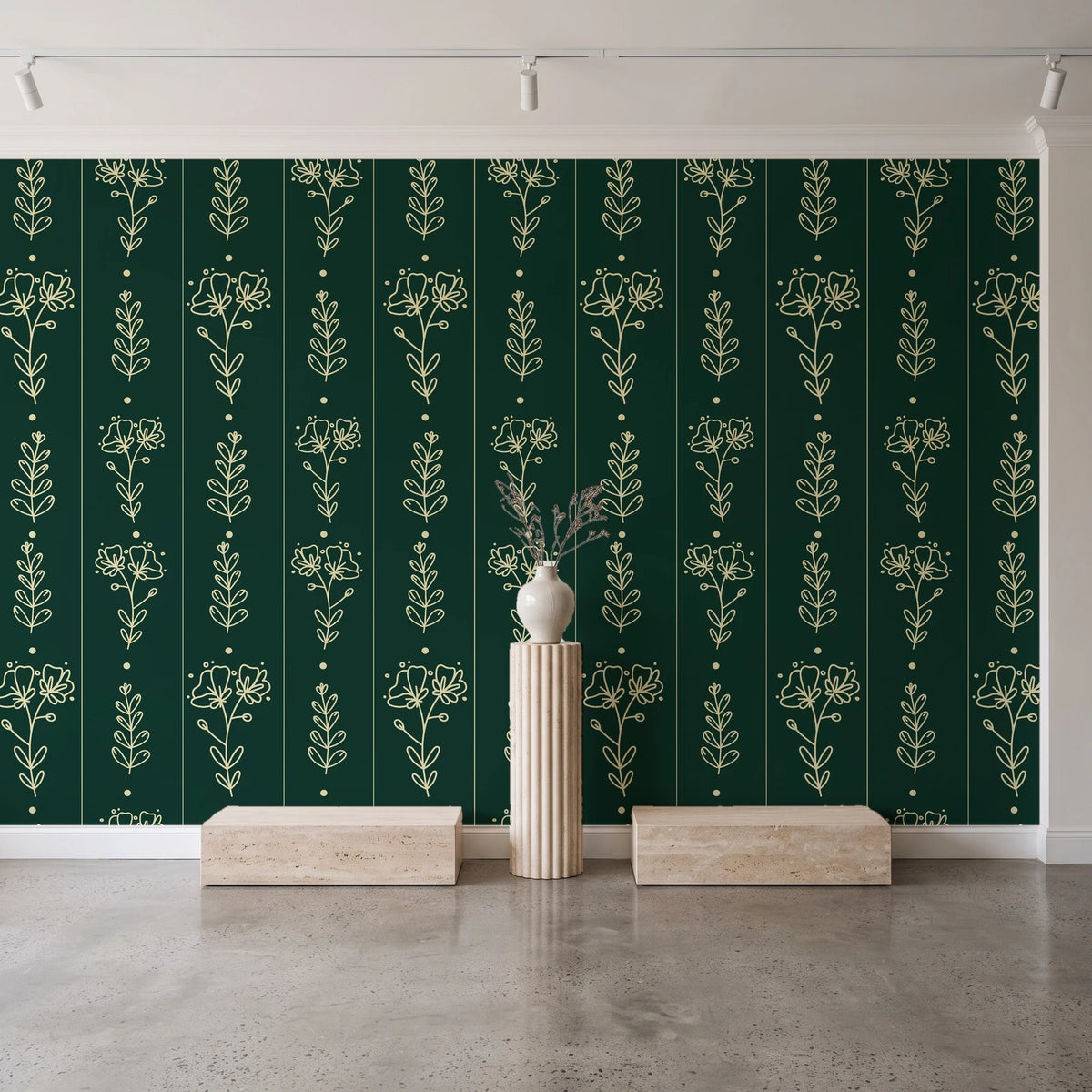 Petal & Thread Emerald botanical stem wallpaper behind a travertine pedestal and vase in a minimal boutique