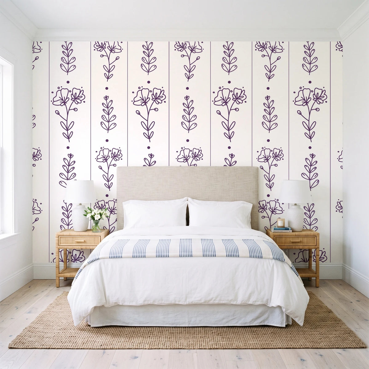 Petal & Thread Plum botanical stem wallpaper behind a queen bed in a bright coastal bedroom