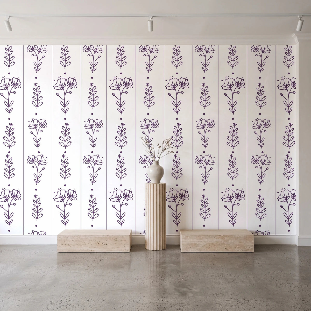 Petal & Thread Plum botanical stem wallpaper behind a travertine pedestal and vase in a minimal boutique